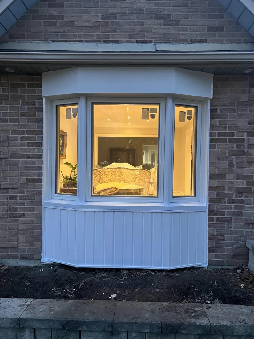 Bay window at dusk with warm interior light, Markham